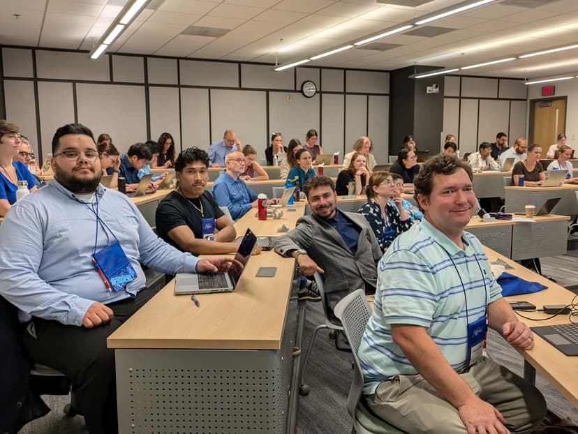 Team members participating in a conference session